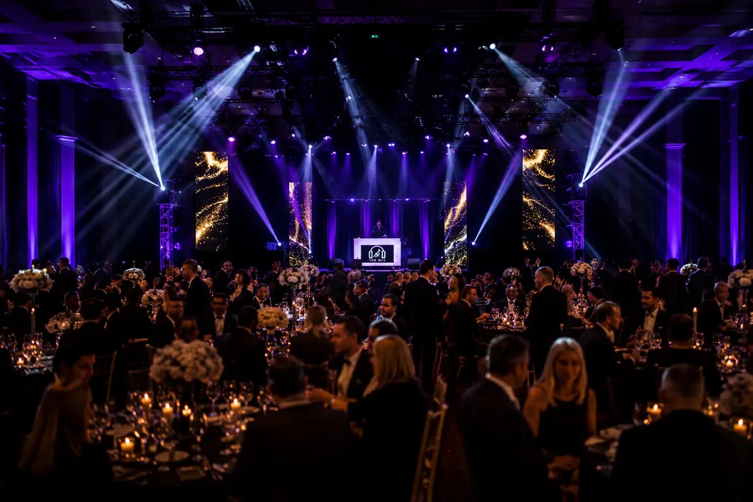 Luxury corporate event room prepared for guests and entertainment